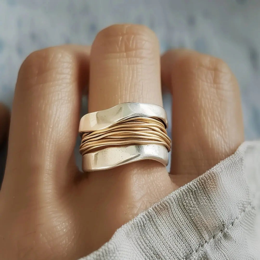 Silver ring with golden threads