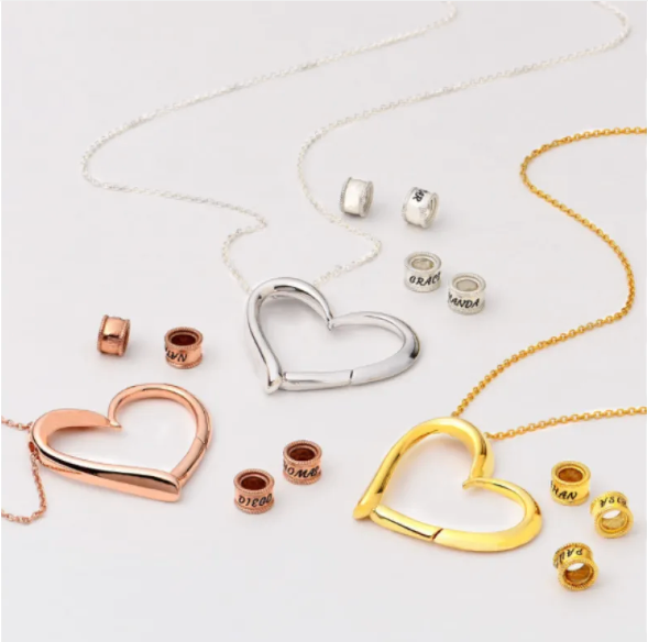 Personalized heart necklace with the option to attach rings and custom name engravings
