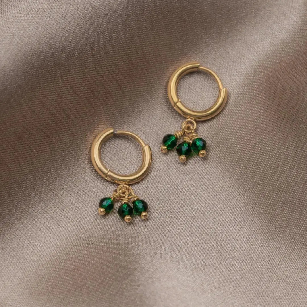 Single earrings with triple green zirconia in gold