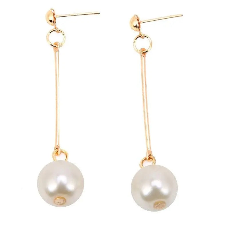 Luxurious dangling earrings with special hand-placed pearls