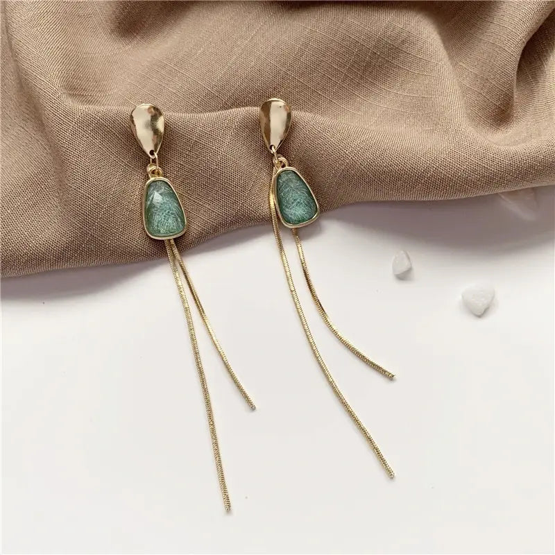 Gold earrings with turquoise stone