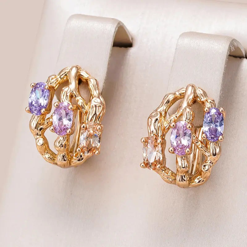 Exotic elegant earrings made of gold and multicolored stones