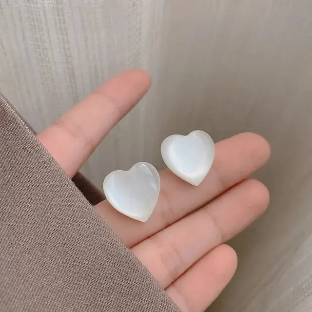 Elegant earrings with white hearts