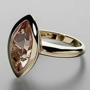 Golden ring made of oval glass