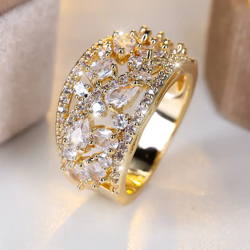 Hollow gold ring with white crystals